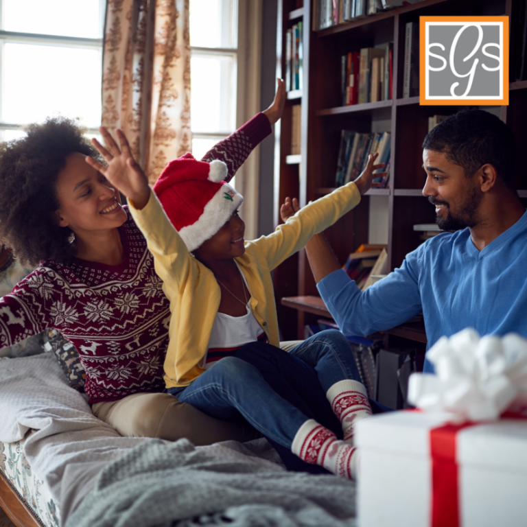 Happy black american family celebrating christmas on their sweet home